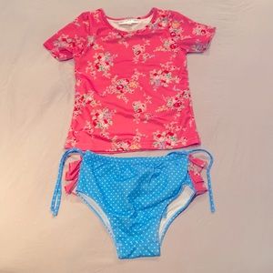 Oopsie Daisy  (Size 7) SPF 50! Brand New Blue and floral Vibrant pink tops.